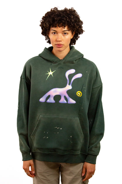 Light skinned androgynous model with natural curly hair wearing shirt in Jasper green