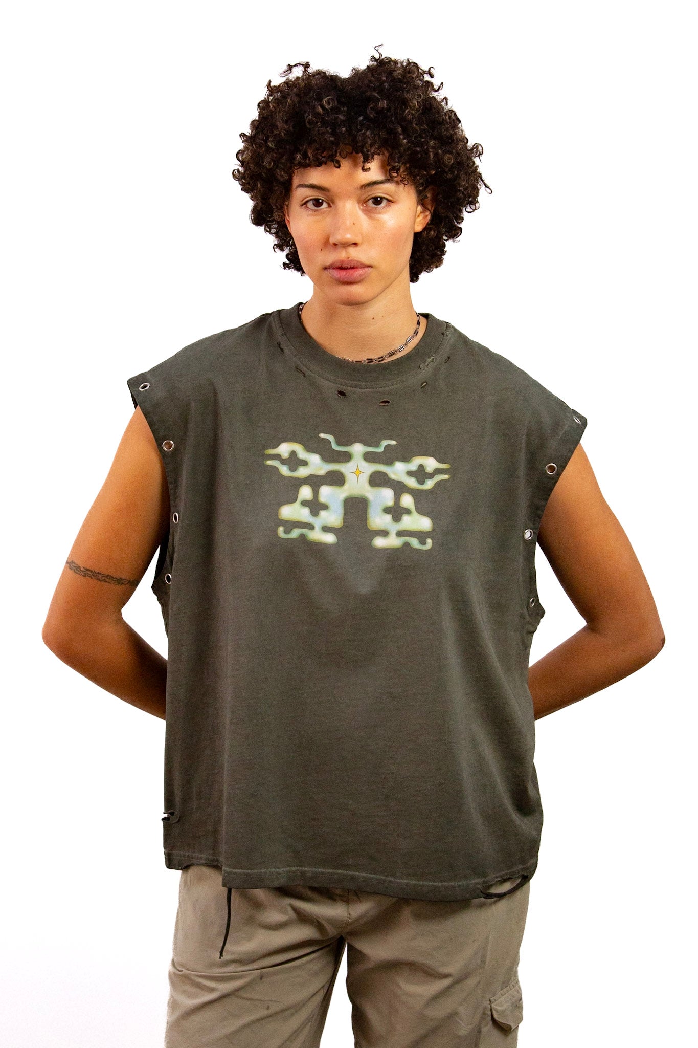 Light skinned androgynous model with natural curly hair wearing shirt in Stone grey