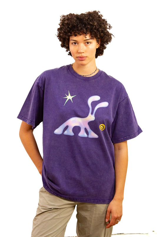 Light skinned androgynous model with natural curly hair wearing shirt in amethyst