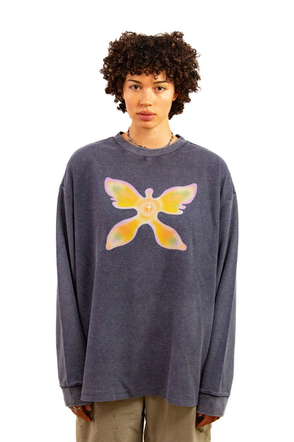 Light skinned androgynous model with natural curly hair wearing shirt in Washed indigo
