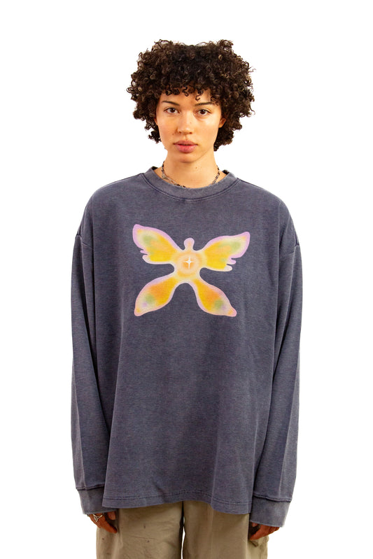 Light skinned androgynous model with natural curly hair wearing shirt in Washed indigo