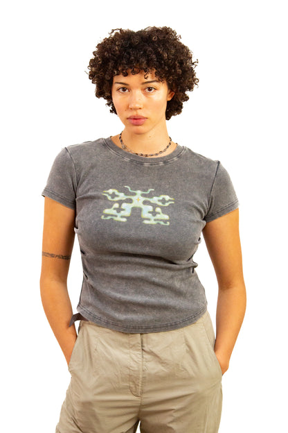 Light skinned androgynous model with natural curly hair wearing shirt in Storm grey