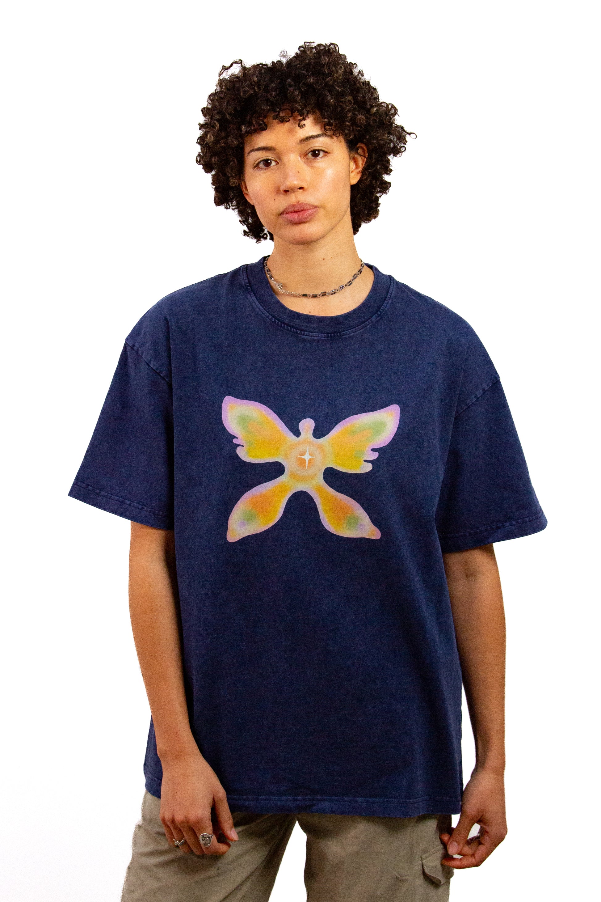Light skinned androgynous model with natural curly hair wearing shirt in Ink blue