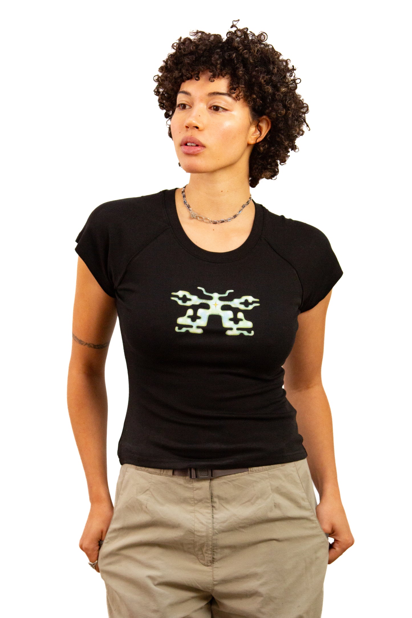 Light skinned androgynous model with natural curly hair wearing shirt in Ink black