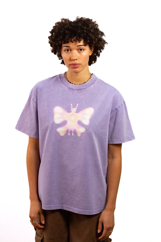 Light skinned androgynous model with natural curly hair wearing shirt in Lilac