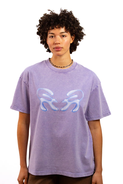 Light skinned androgynous model with natural curly hair wearing shirt in Lilac