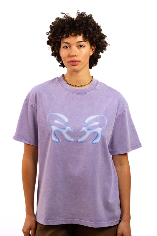 Light skinned androgynous model with natural curly hair wearing shirt in Lilac